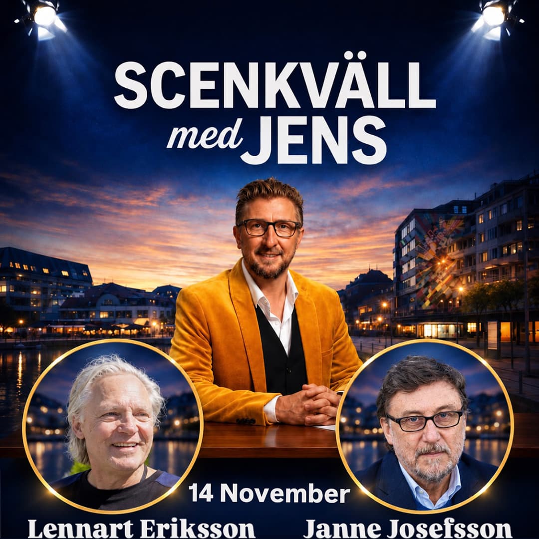 Man i orange kavaj vid ett skrivbord